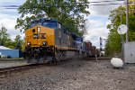CSX 7415 leads a freight across the NS Diamonds